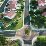 An ariel view of a wealthy neighborhood, for "Comparing Merchant Cash Advances and Real Estate: Which Alternative Asset Fits Your Portfolio?"