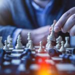 Someone moving a king in game of chess, for "Which High-Net-Worth Tax Strategy Could Work for You?"